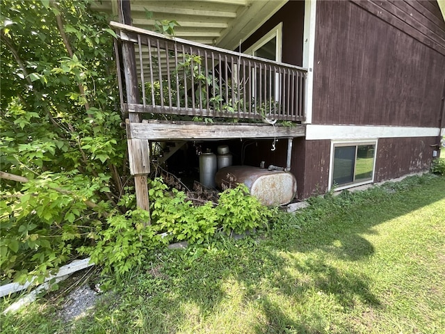 view of side of home with a yard