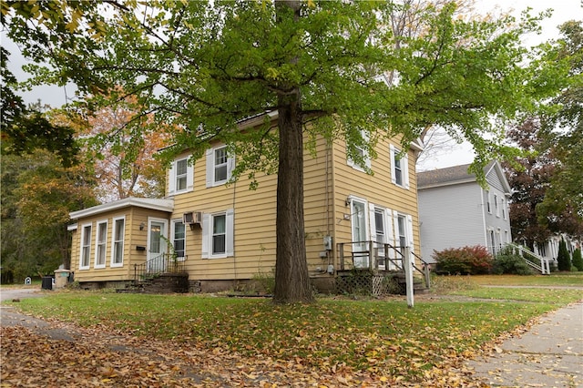 view of property exterior with a lawn