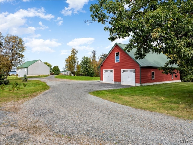 garage with a yard