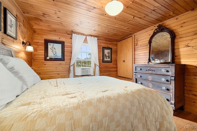 bedroom featuring hardwood / wood-style floors, wooden walls, cooling unit, and wood ceiling