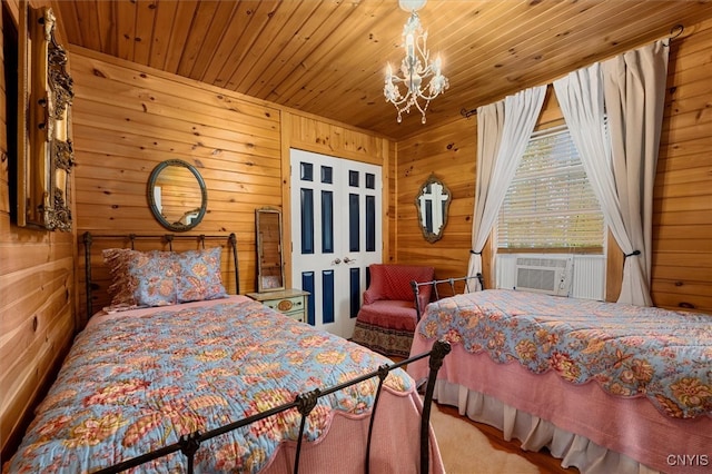 carpeted bedroom featuring a notable chandelier, wood walls, cooling unit, and wooden ceiling