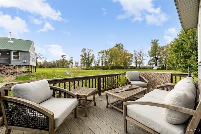 deck featuring a lawn and outdoor lounge area