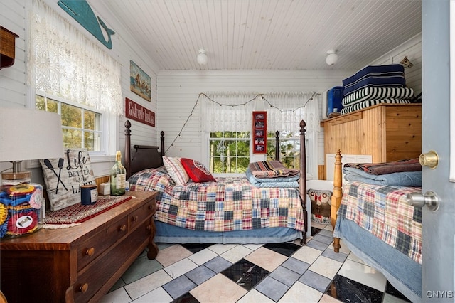 bedroom with wood walls