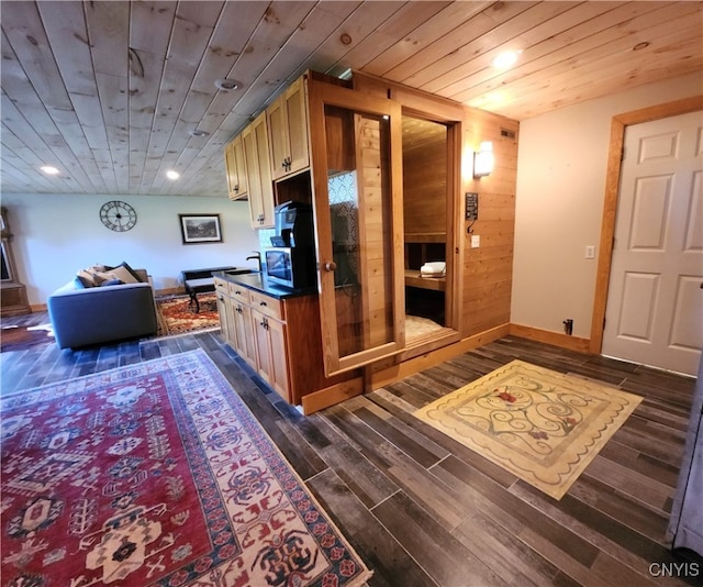 kitchen featuring dark hardwood / wood-style flooring, wood ceiling, and lofted ceiling