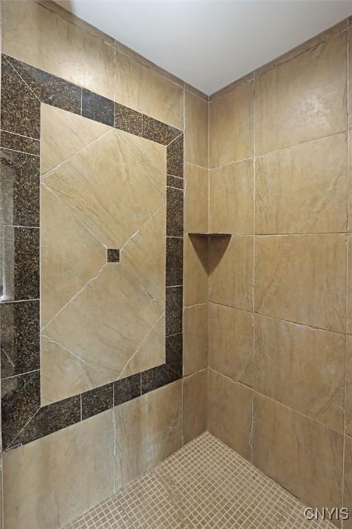 bathroom with tiled shower