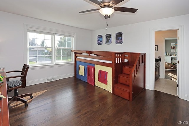 bedroom featuring ceiling fan and dark hardwood / wood-style floors