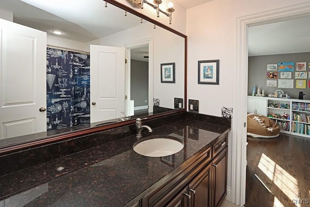 bathroom featuring hardwood / wood-style flooring and vanity