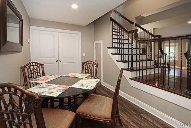 dining area featuring dark hardwood / wood-style flooring