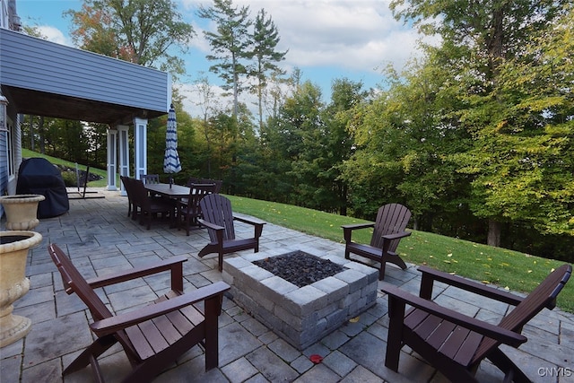 view of patio / terrace featuring grilling area and a fire pit