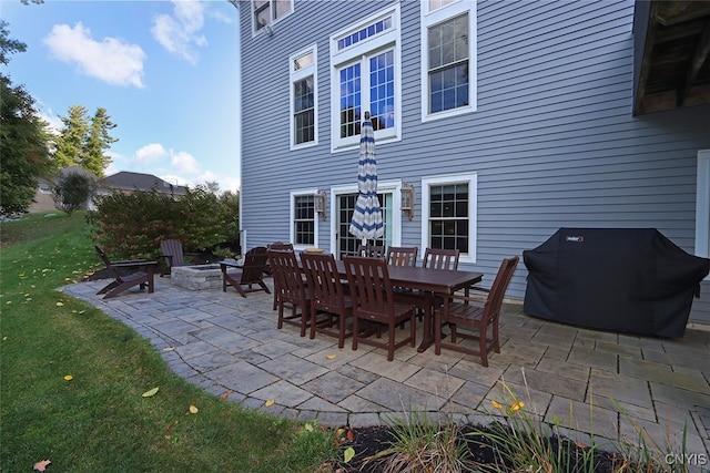 view of patio with grilling area and a fire pit