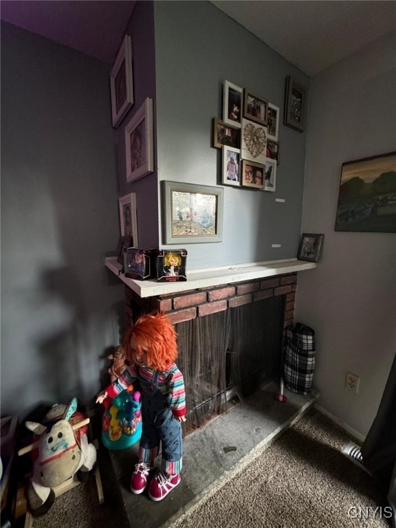 interior space with a fireplace and carpet flooring