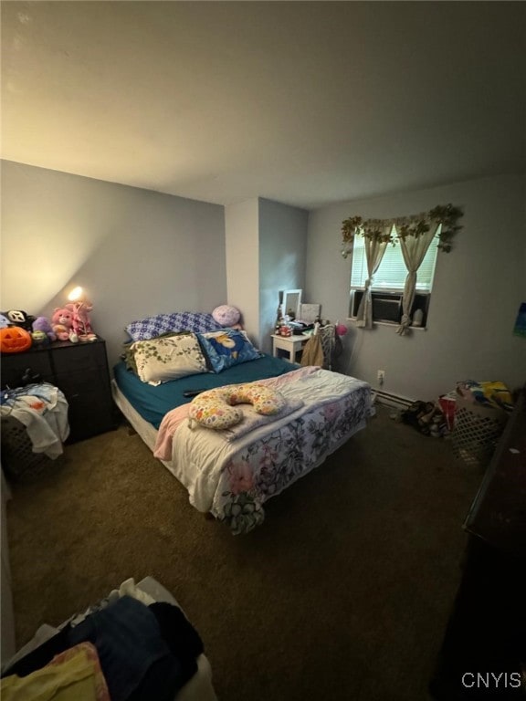 bedroom featuring a baseboard heating unit and carpet