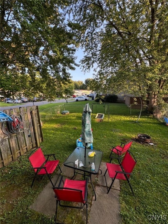 view of yard with a fire pit