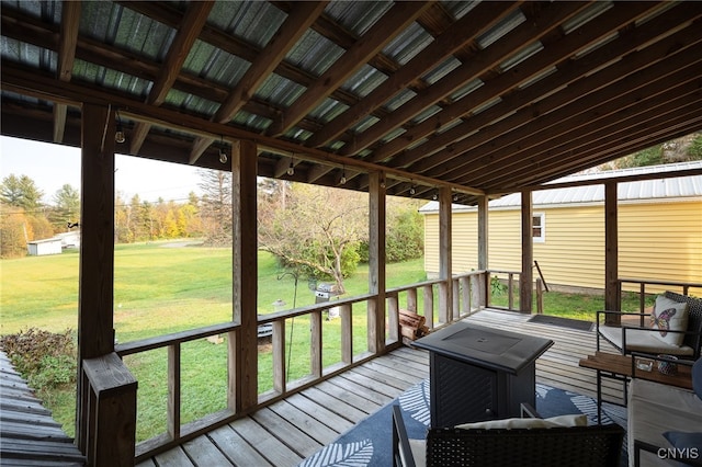 sunroom / solarium featuring lofted ceiling