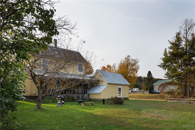 back of house with a yard