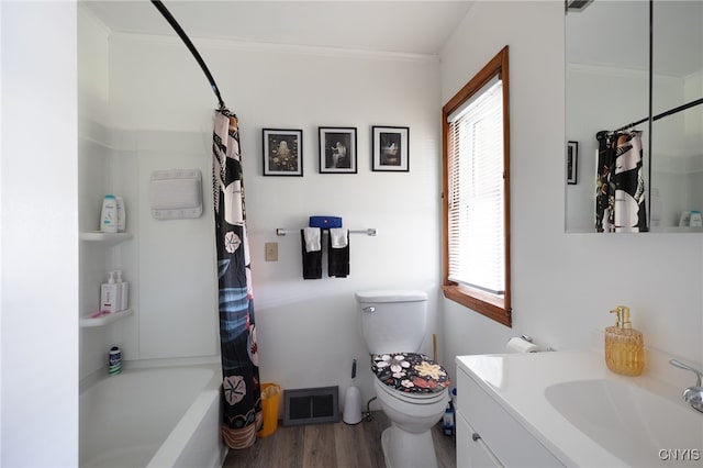 full bathroom with vanity, ornamental molding, wood-type flooring, toilet, and shower / tub combo with curtain