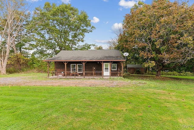 view of front of home featuring a front yard and covered porch