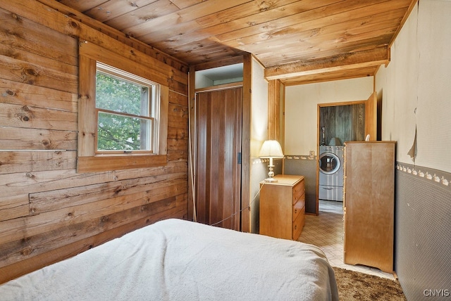 bedroom featuring washer / clothes dryer, wooden ceiling, and wood walls