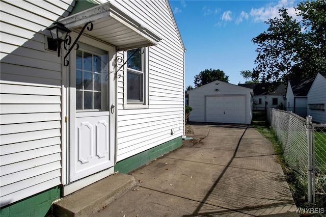 view of property exterior featuring a garage and an outbuilding