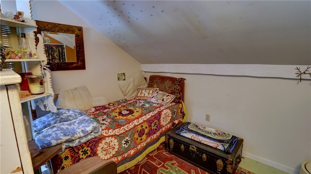 bedroom featuring lofted ceiling