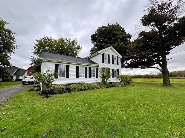 view of front of home with a front yard