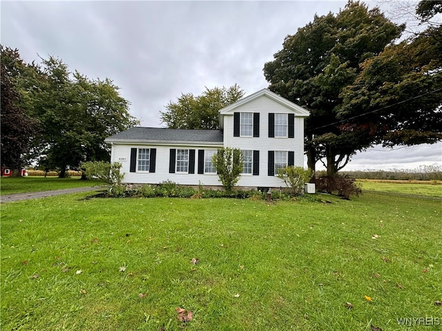 view of front of home with a front yard