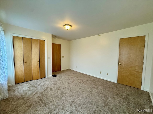 unfurnished bedroom with carpet