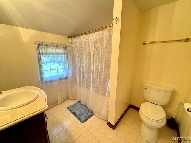 bathroom with vanity, curtained shower, toilet, and tile patterned floors