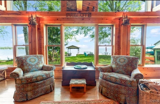 sunroom / solarium with a water view
