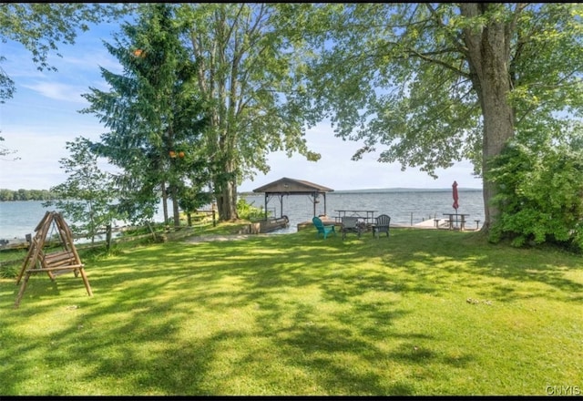 view of yard featuring a water view and a gazebo