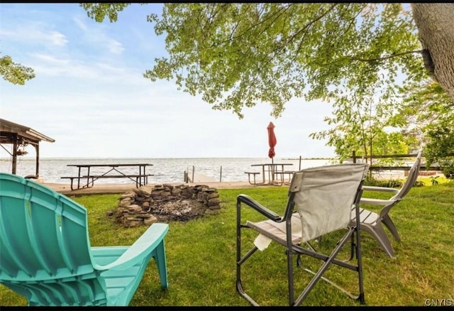 exterior space with a water view and a boat dock