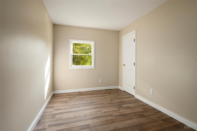 empty room with hardwood / wood-style floors