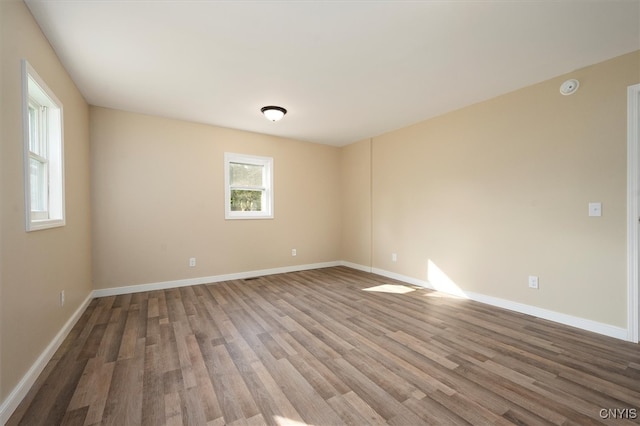 empty room featuring hardwood / wood-style flooring