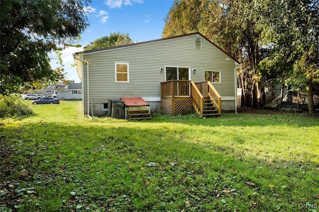 rear view of property with a lawn