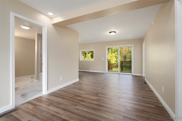 empty room with wood-type flooring