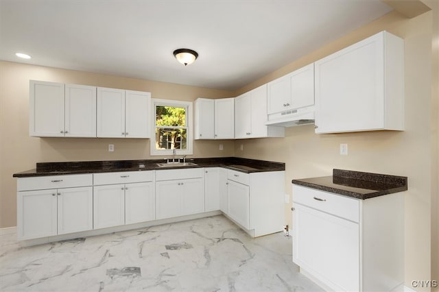 kitchen with sink and white cabinetry