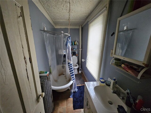 full bathroom featuring vanity, tile patterned floors, toilet, and shower / bath combo