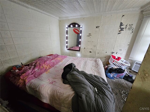 bedroom with tile walls