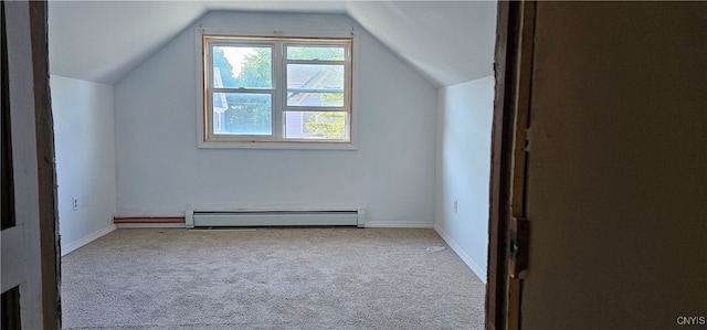 bonus room with light carpet, vaulted ceiling, and a baseboard heating unit