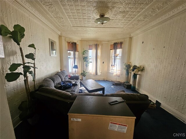 carpeted living room with ornamental molding