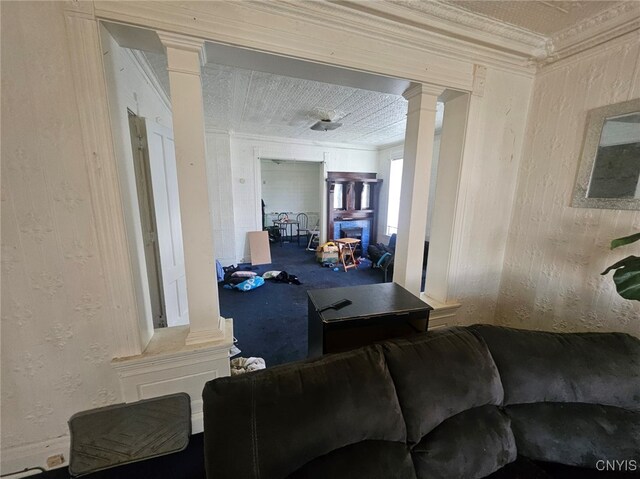 living room featuring a fireplace and crown molding