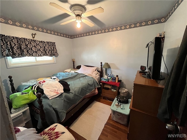 bedroom with wood-type flooring and ceiling fan