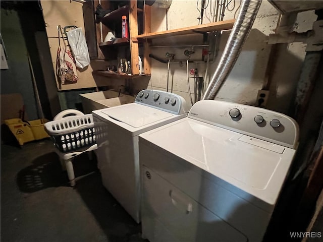 clothes washing area featuring independent washer and dryer