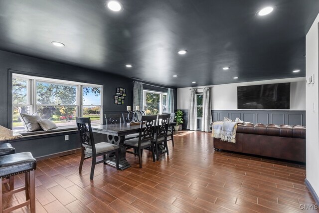 dining area featuring dark wood-type flooring