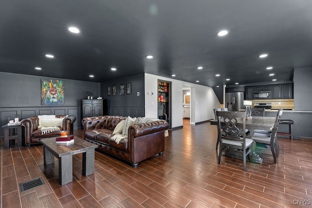 living room featuring dark hardwood / wood-style floors