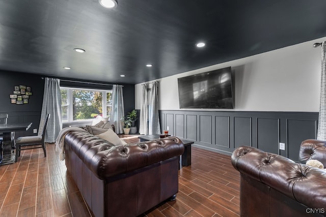 cinema room with dark hardwood / wood-style flooring