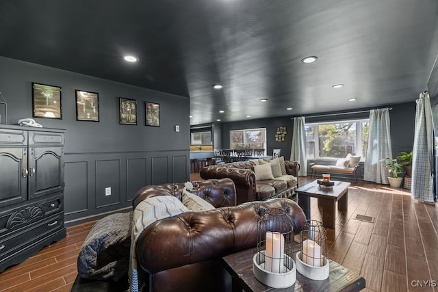 home theater room featuring dark hardwood / wood-style flooring