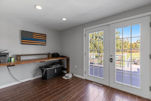 doorway with french doors and dark hardwood / wood-style flooring