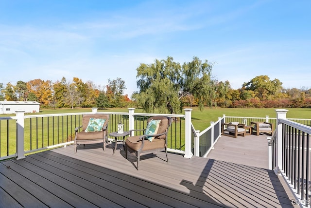 wooden terrace with a lawn