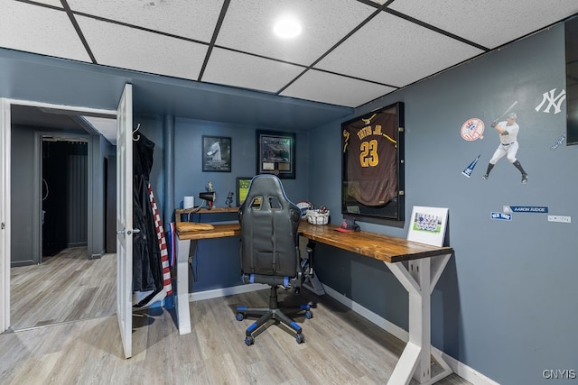 office area featuring a drop ceiling and hardwood / wood-style floors